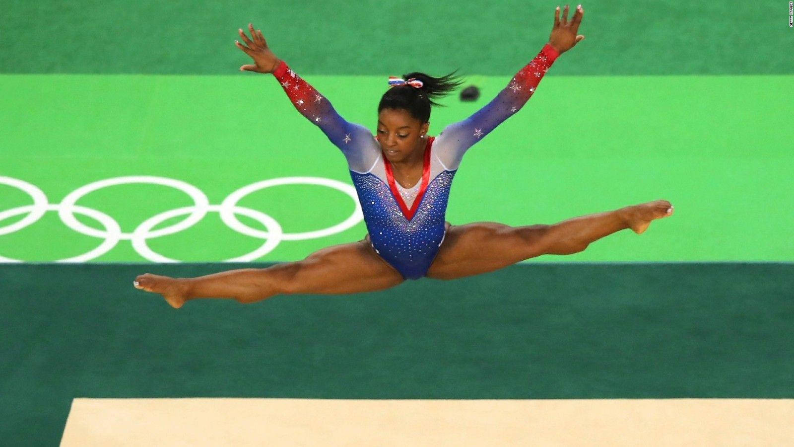 Olympian Simone Biles Airborne Background