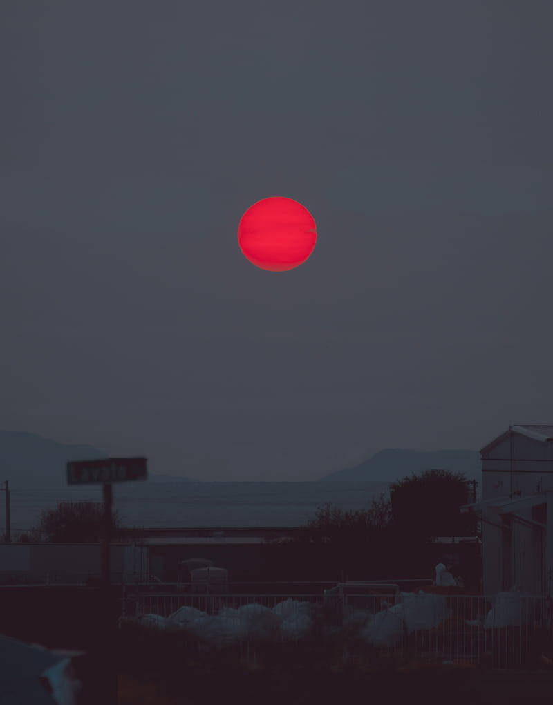 Ominous Red Sun In The Sky Background