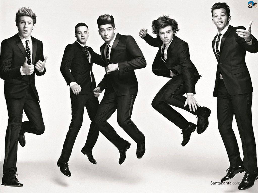 One Direction Performing In All Black Suits Background