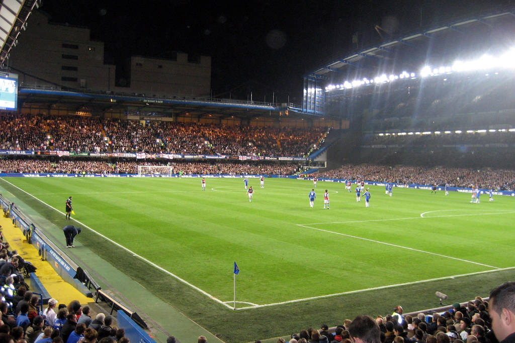 Ongoing Evening Match At Stamford Bridge Background