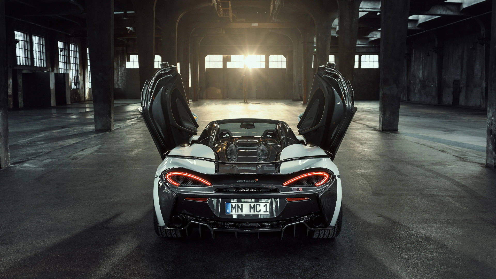 Open-doored Mclaren Spyder 570s