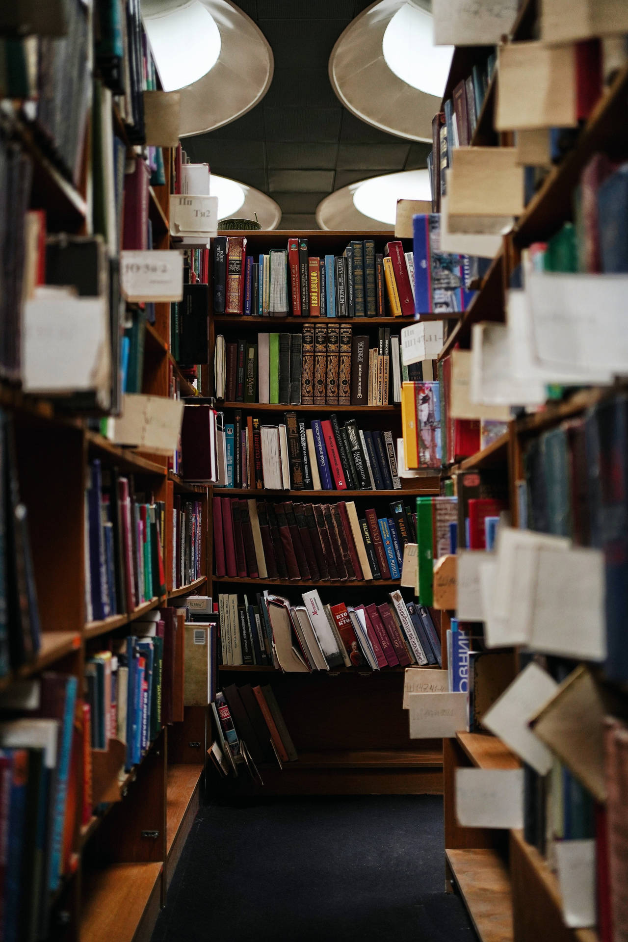 Opened Books From Bookshelve Background