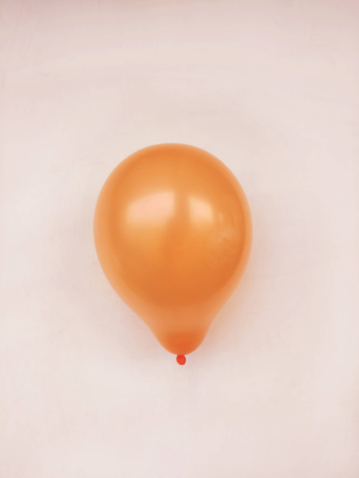 Orange Balloon In Beige Background