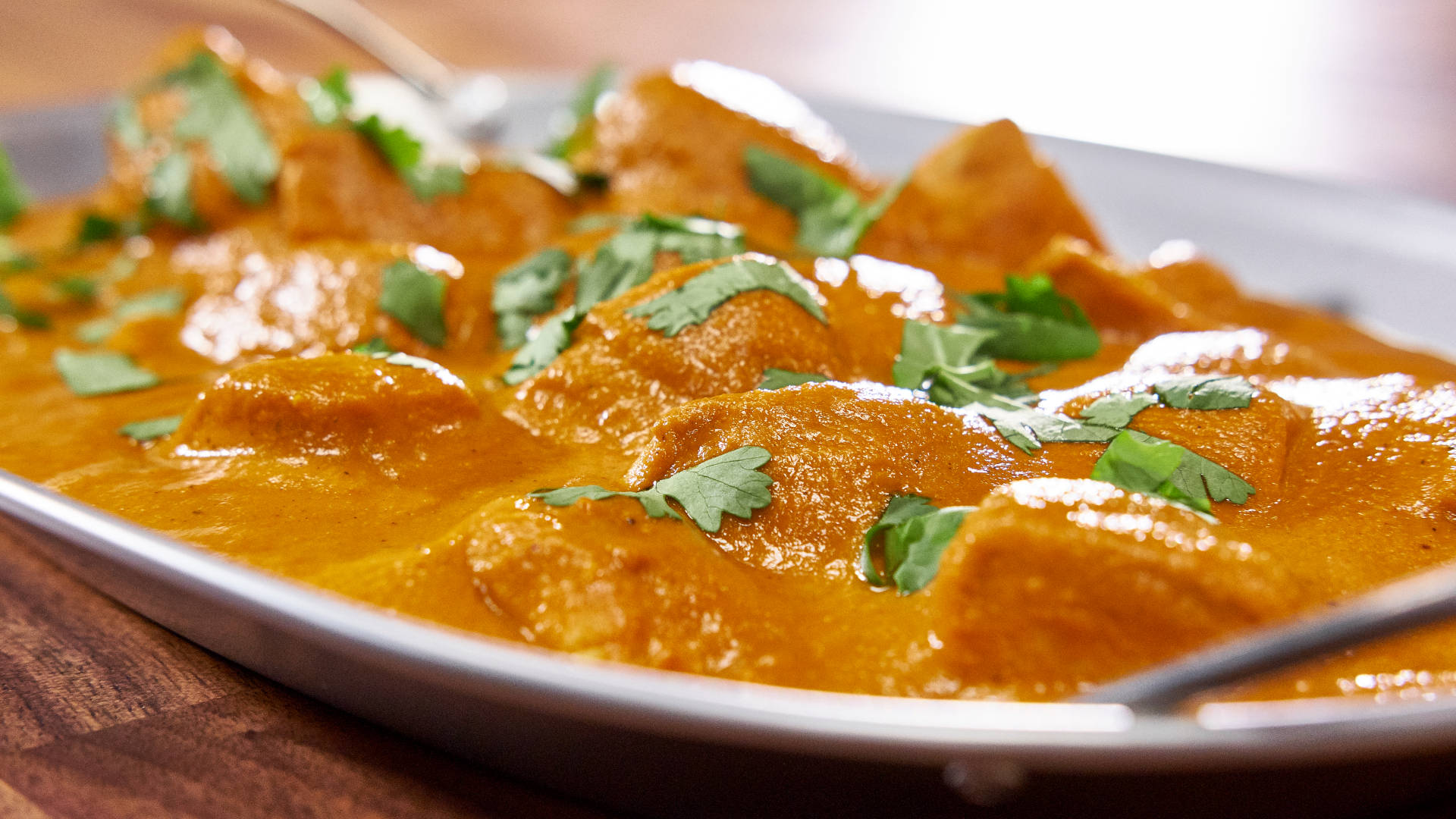 Orange Colored Butter Chicken Dish Background