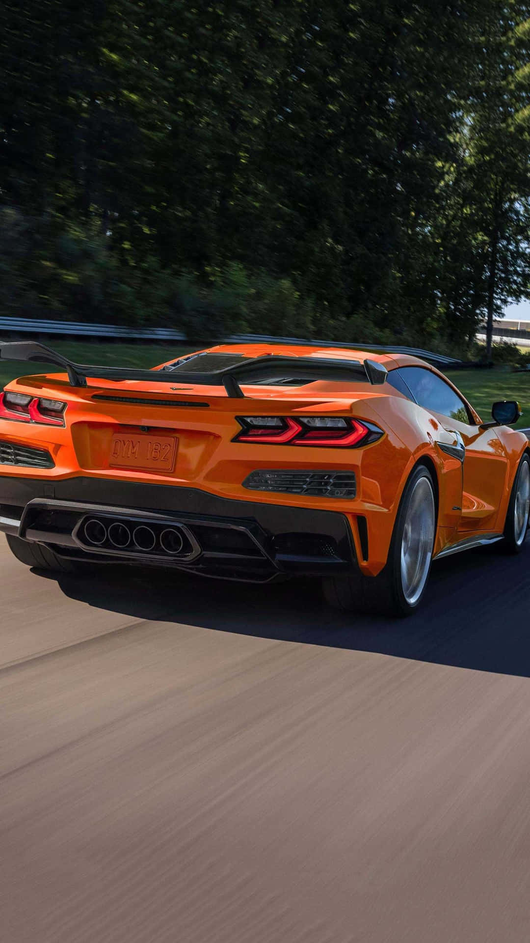 Orange Corvette C8 Rear View Speeding Background