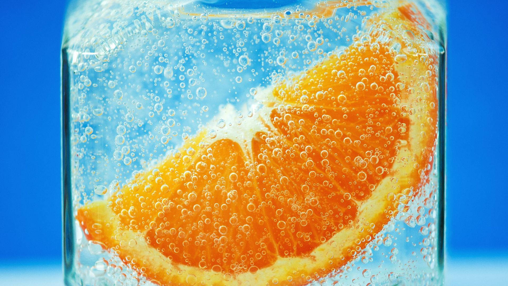 Orange Fruit In Ice Background