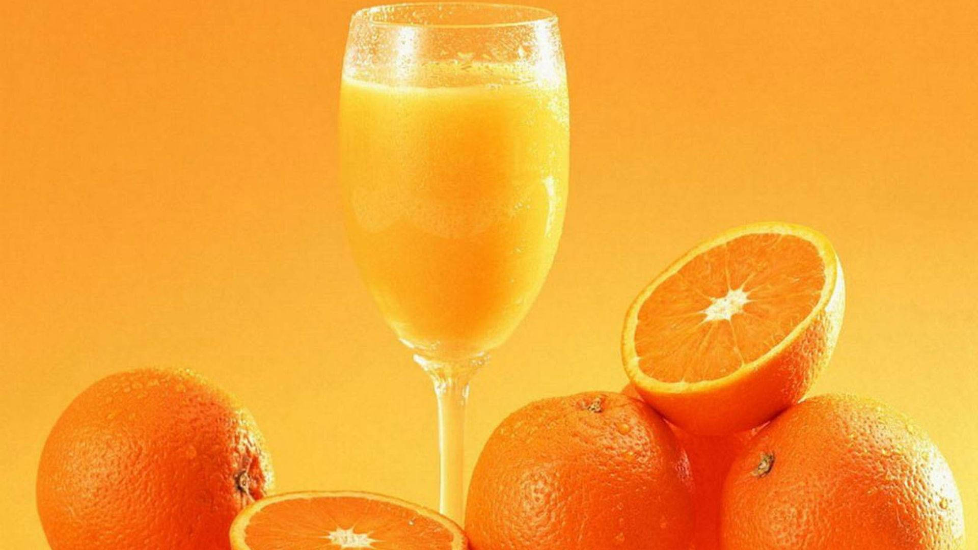Orange Fruit Juice In Glass Background