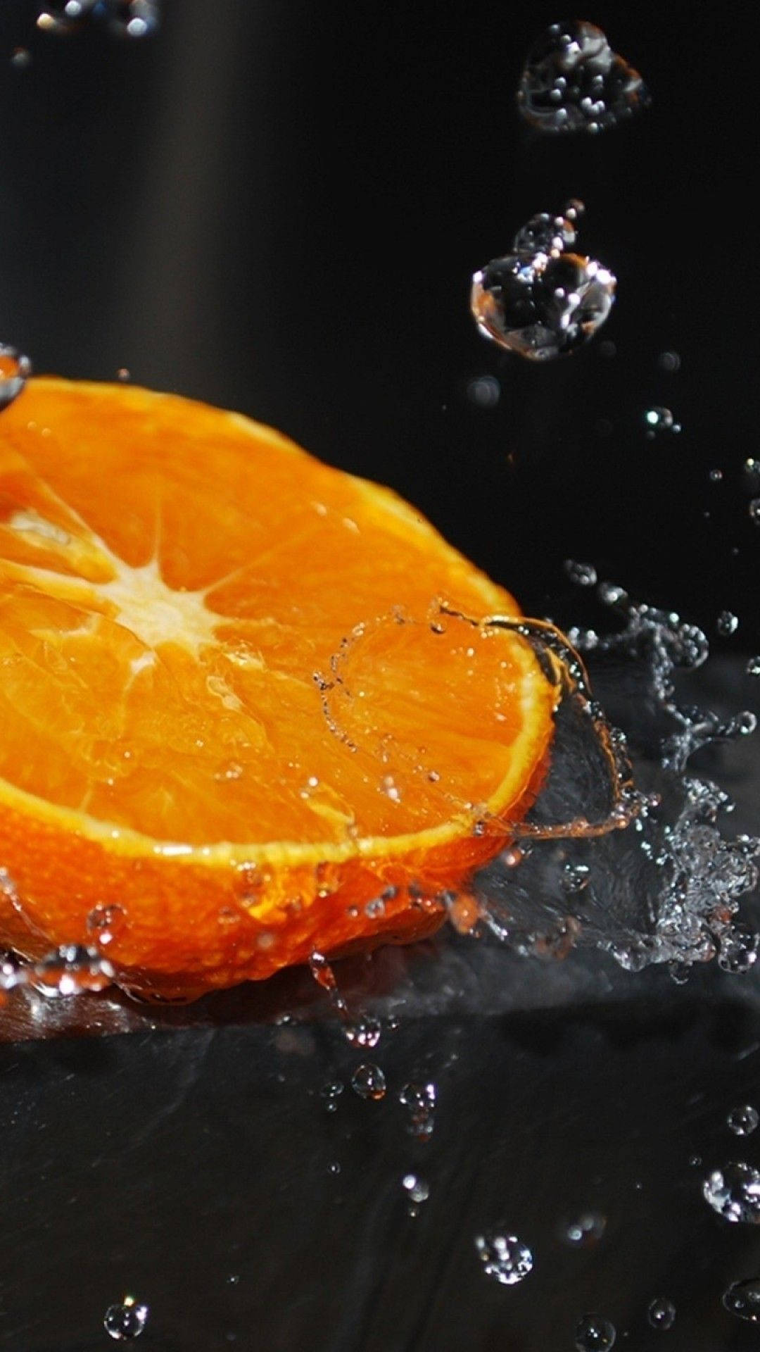 Orange Fruit With Water Splashes Background