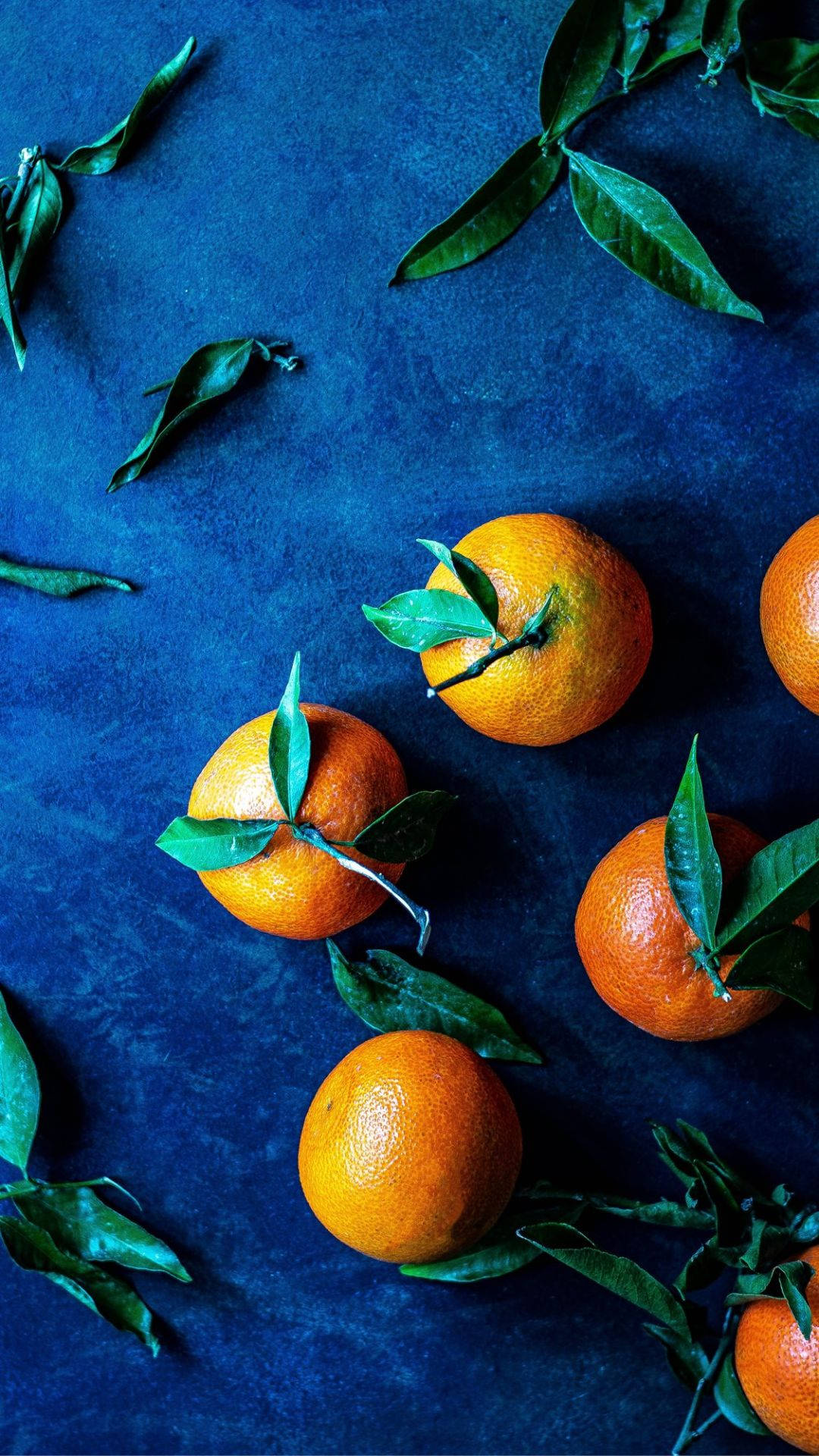 Orange Fruits On Blue Mat Background