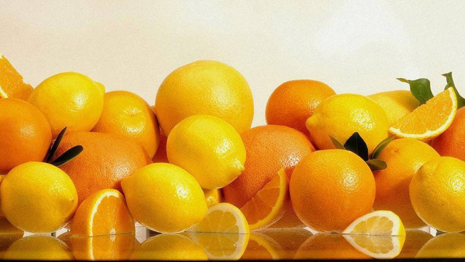Orange Fruits On The Table Background