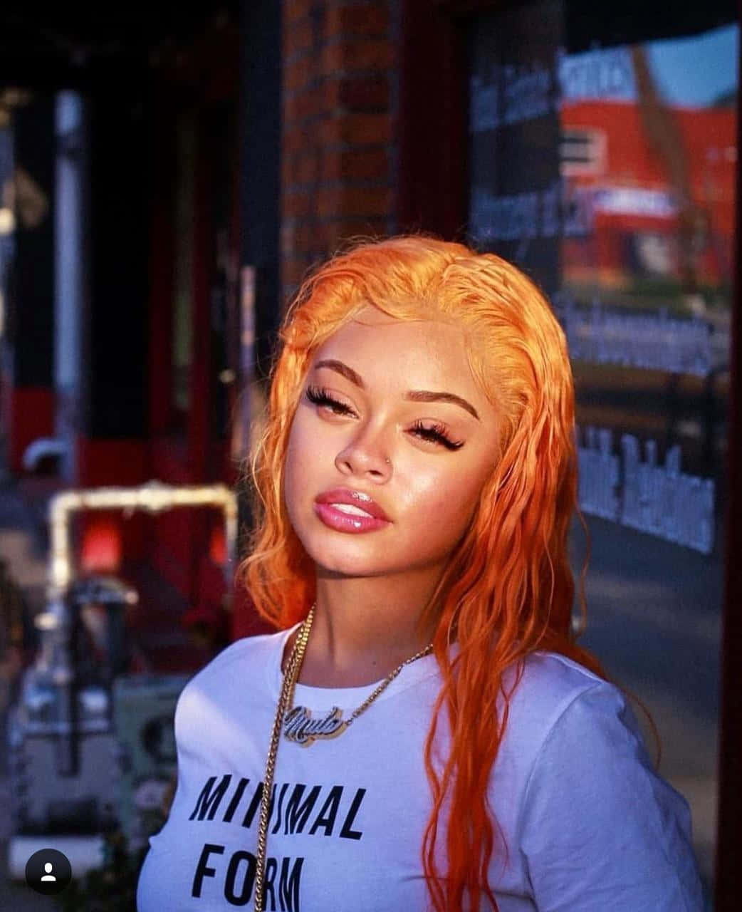 Orange Haired Woman In Urban Setting Background