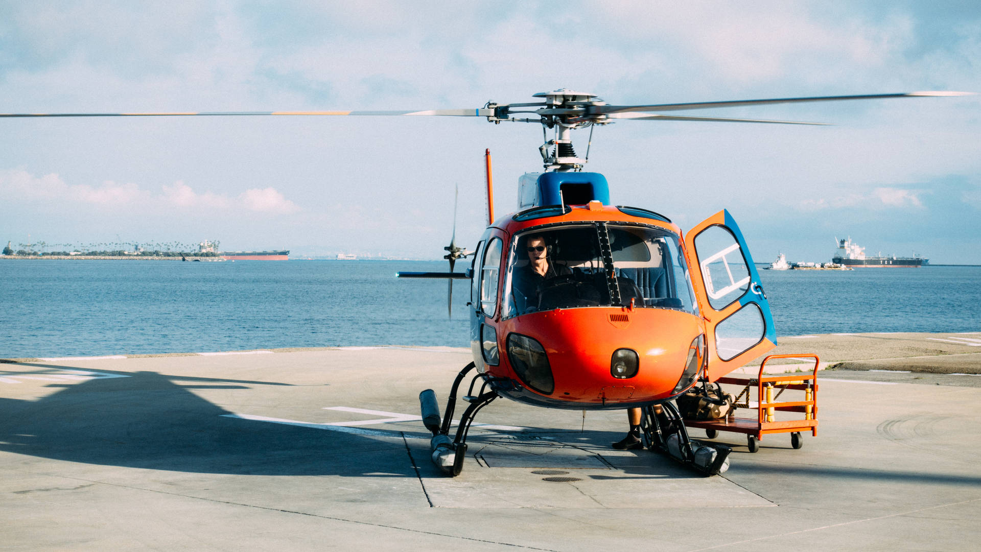 Orange Helicopter Near Sea Background