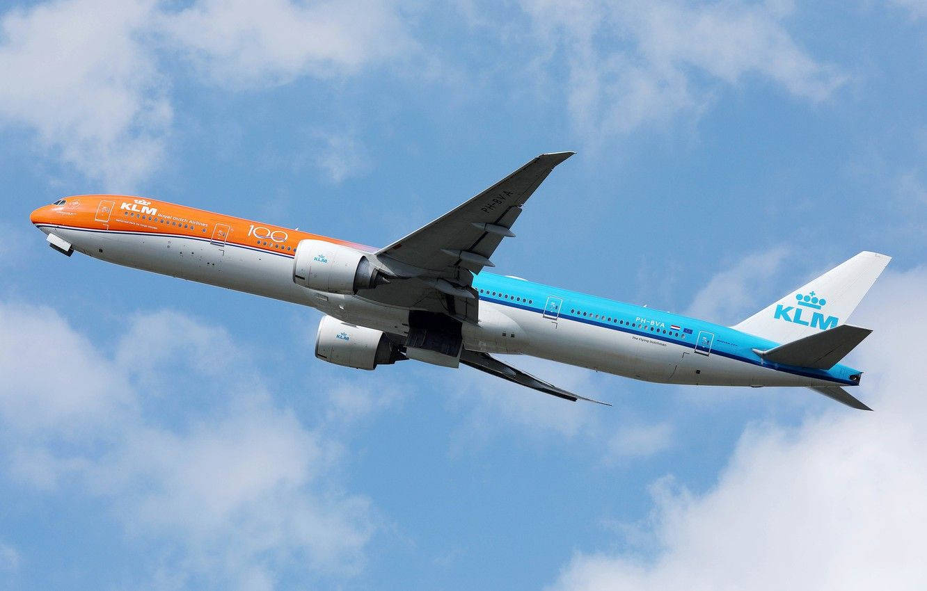 Orange Klm Airplane In The Sky Background