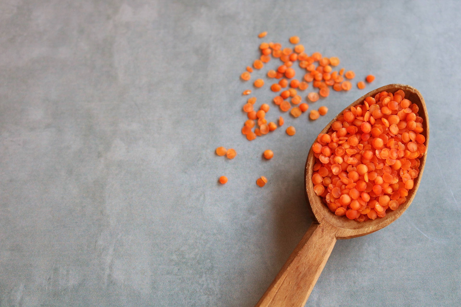 Orange Lentils In Scoop Background