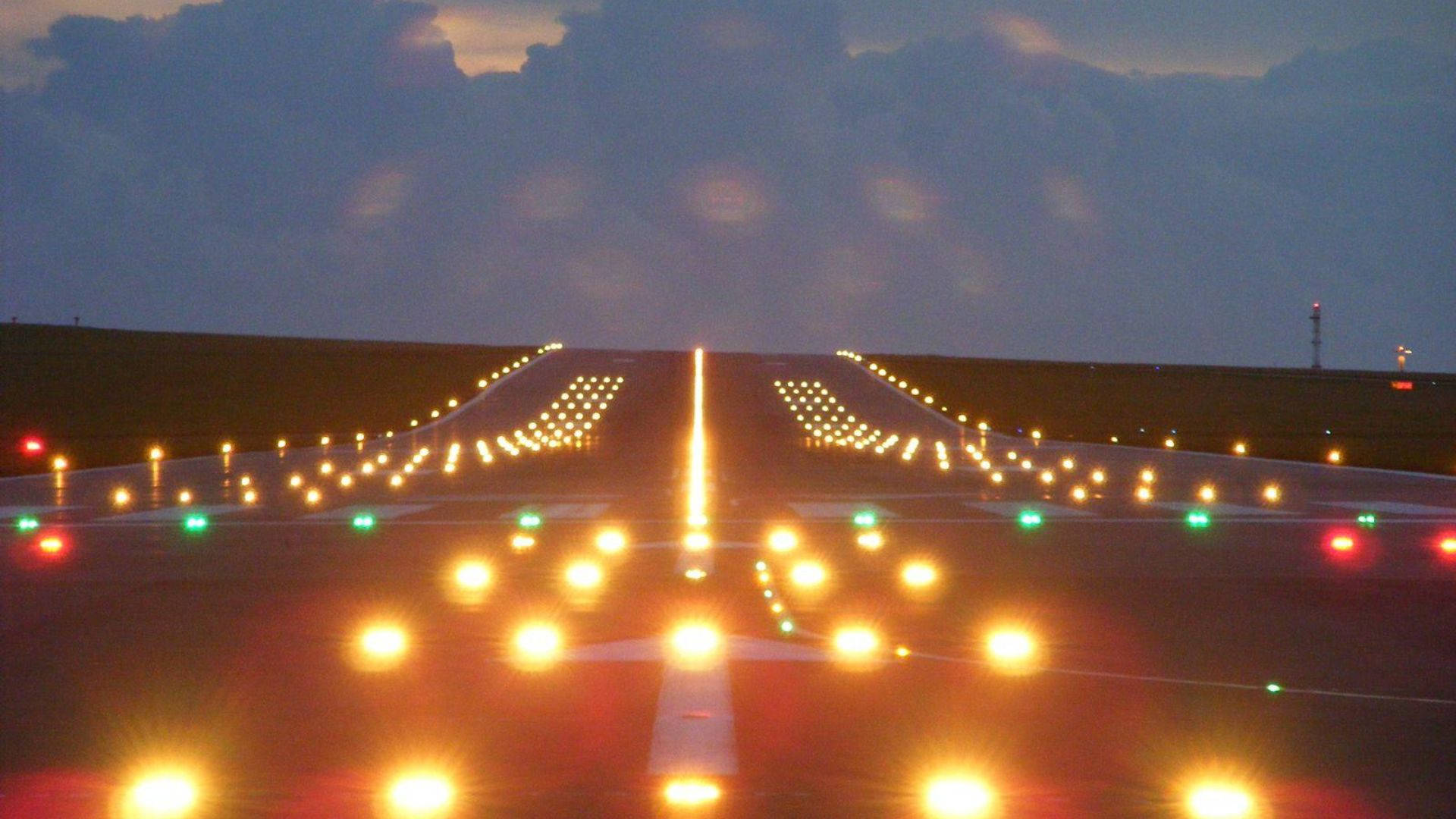 Orange Lights On Runway Background