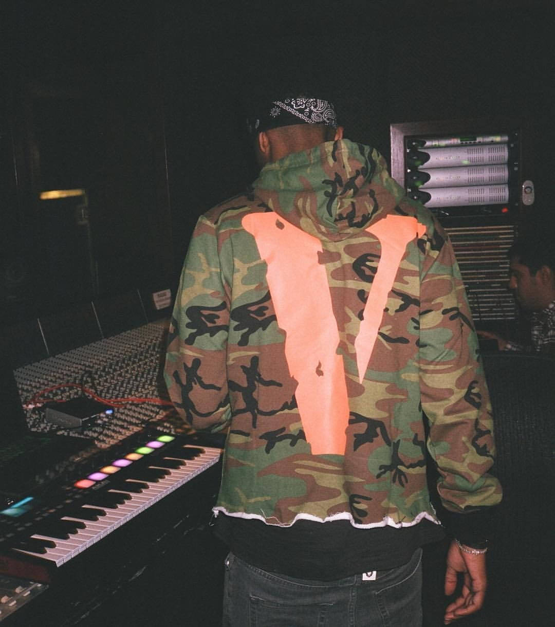 Orange Logo In Camouflage Vlone Pfp Background