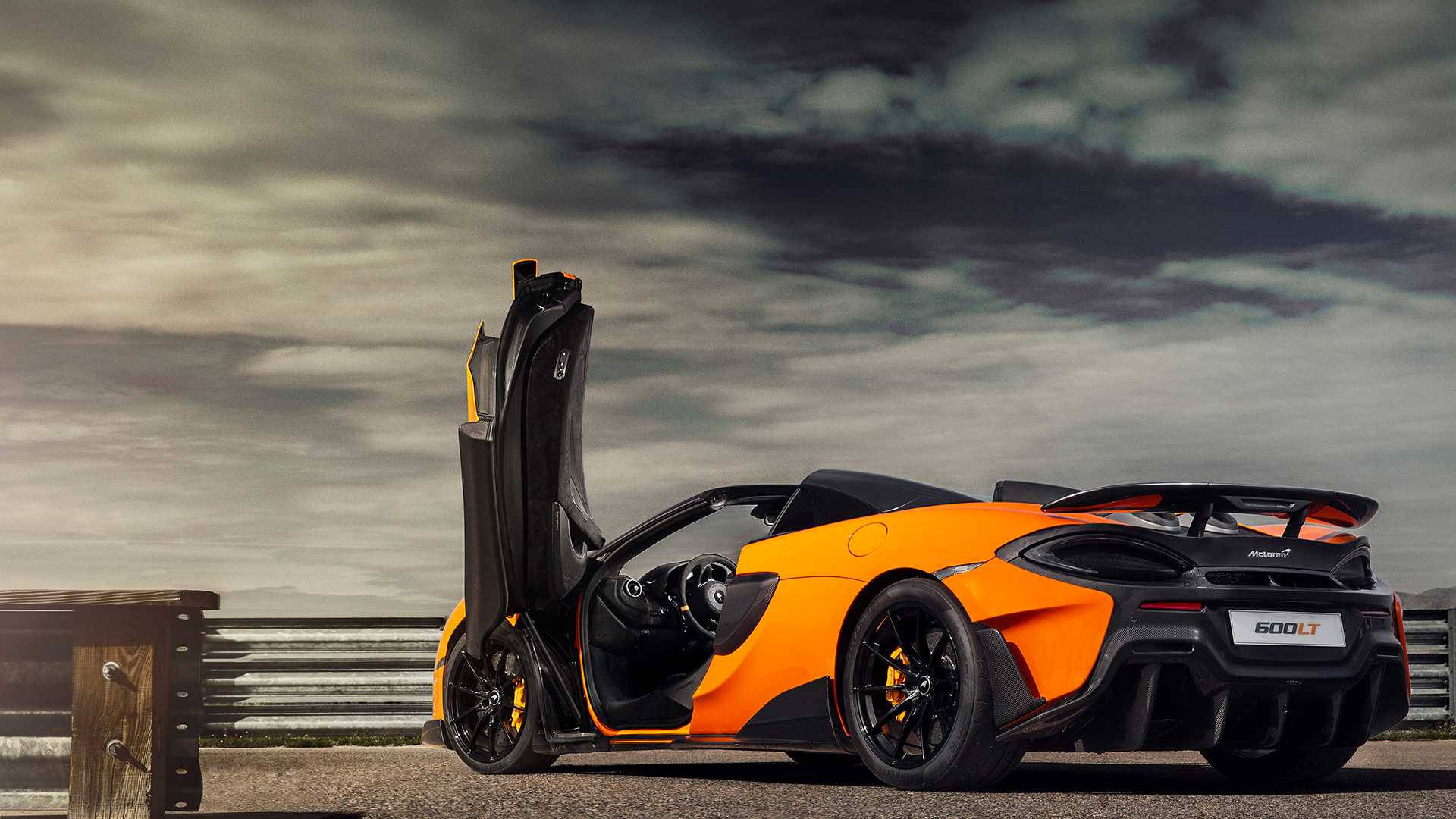 Orange Mclaren Spyder On Mountain Background