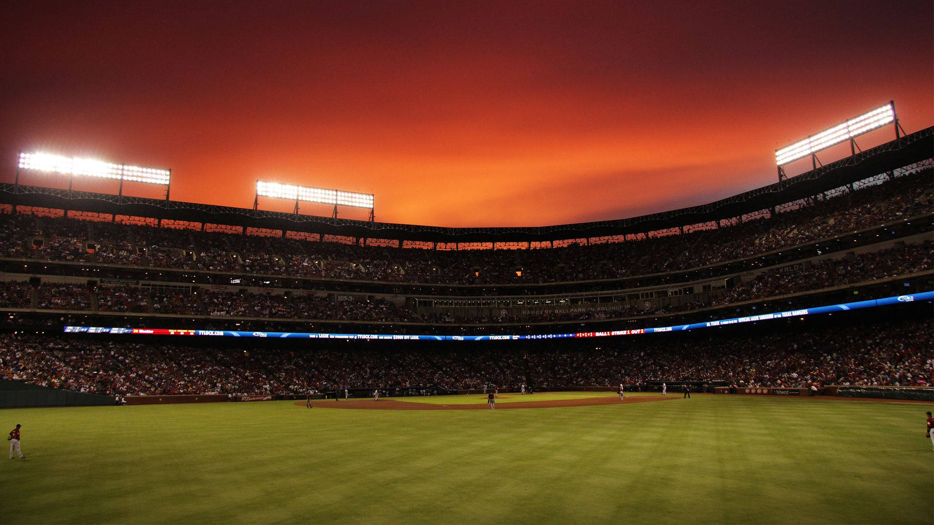 Orange Sky In Baseball Stadium Background