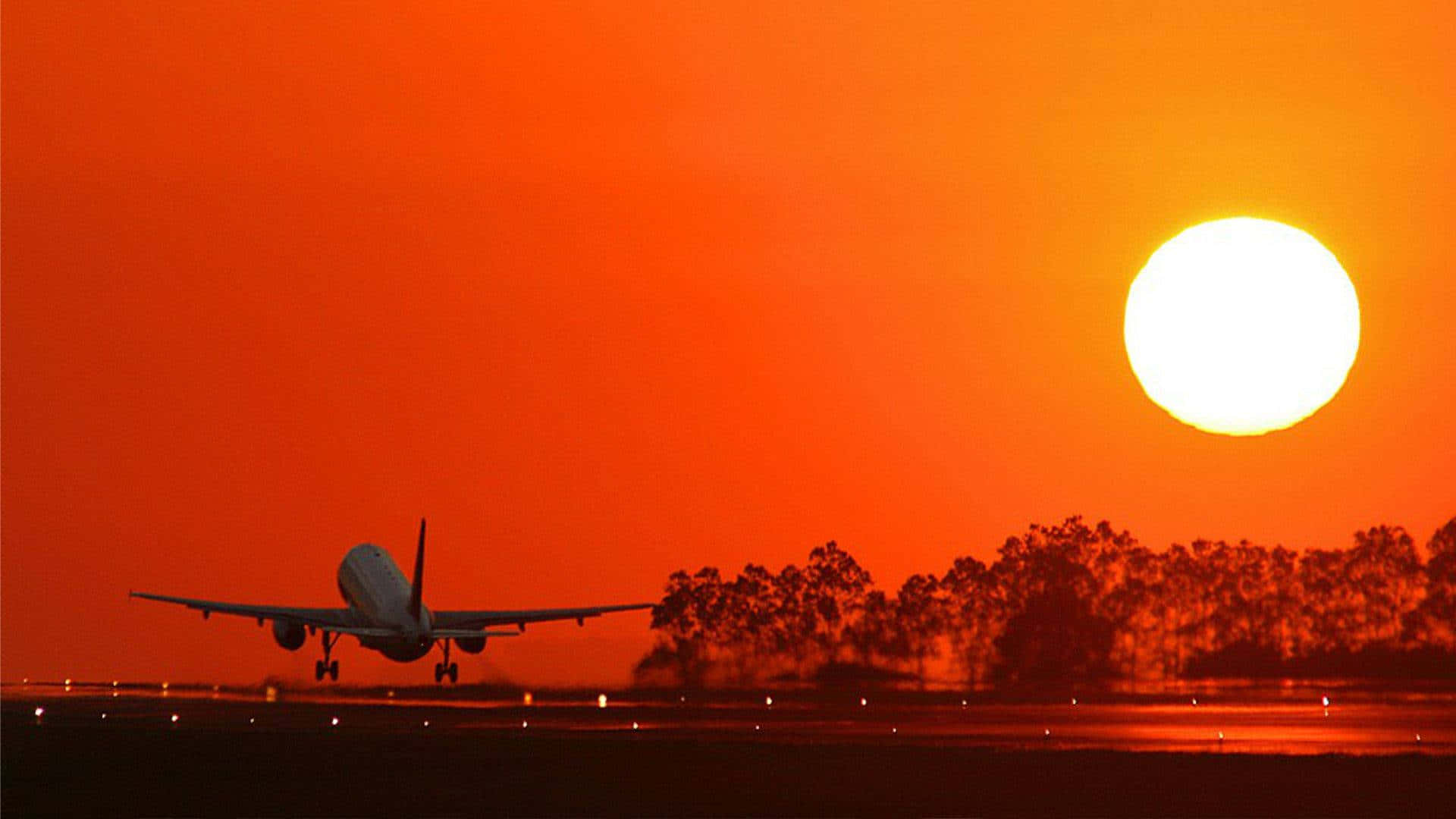 Orange Sunset And Plane Background Background