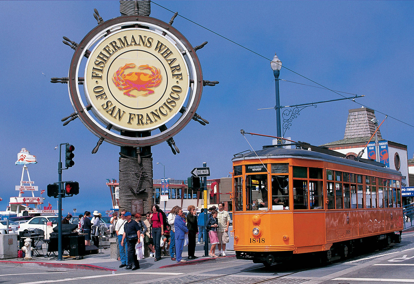 Orange Tram By Fishermans Wharf Sign Background