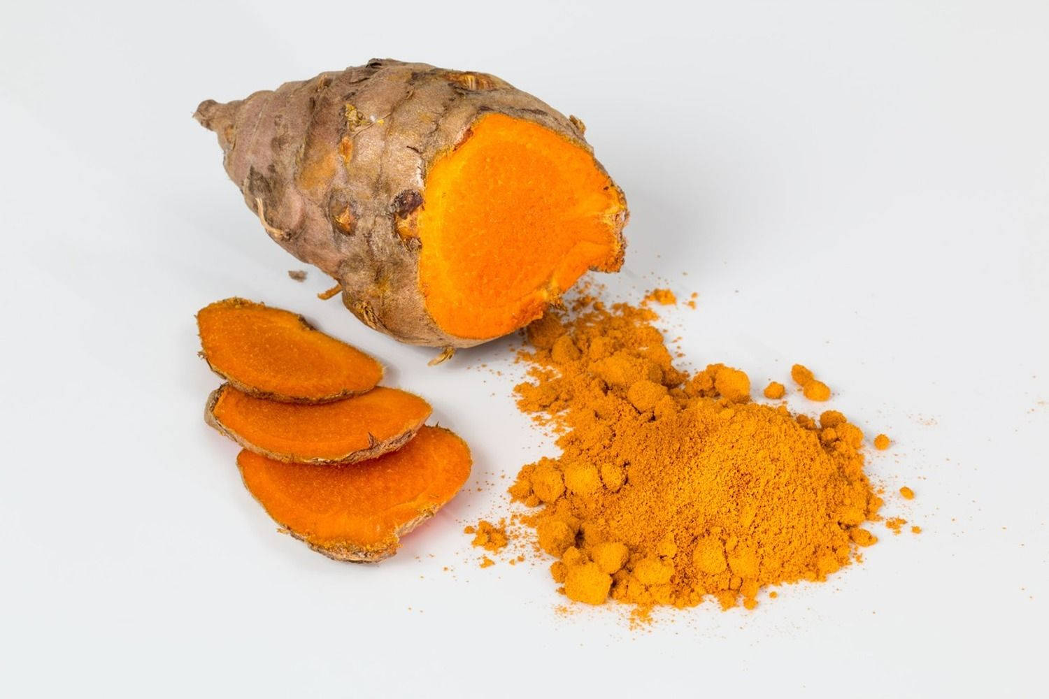 Orange Turmeric Powder And Slices Background