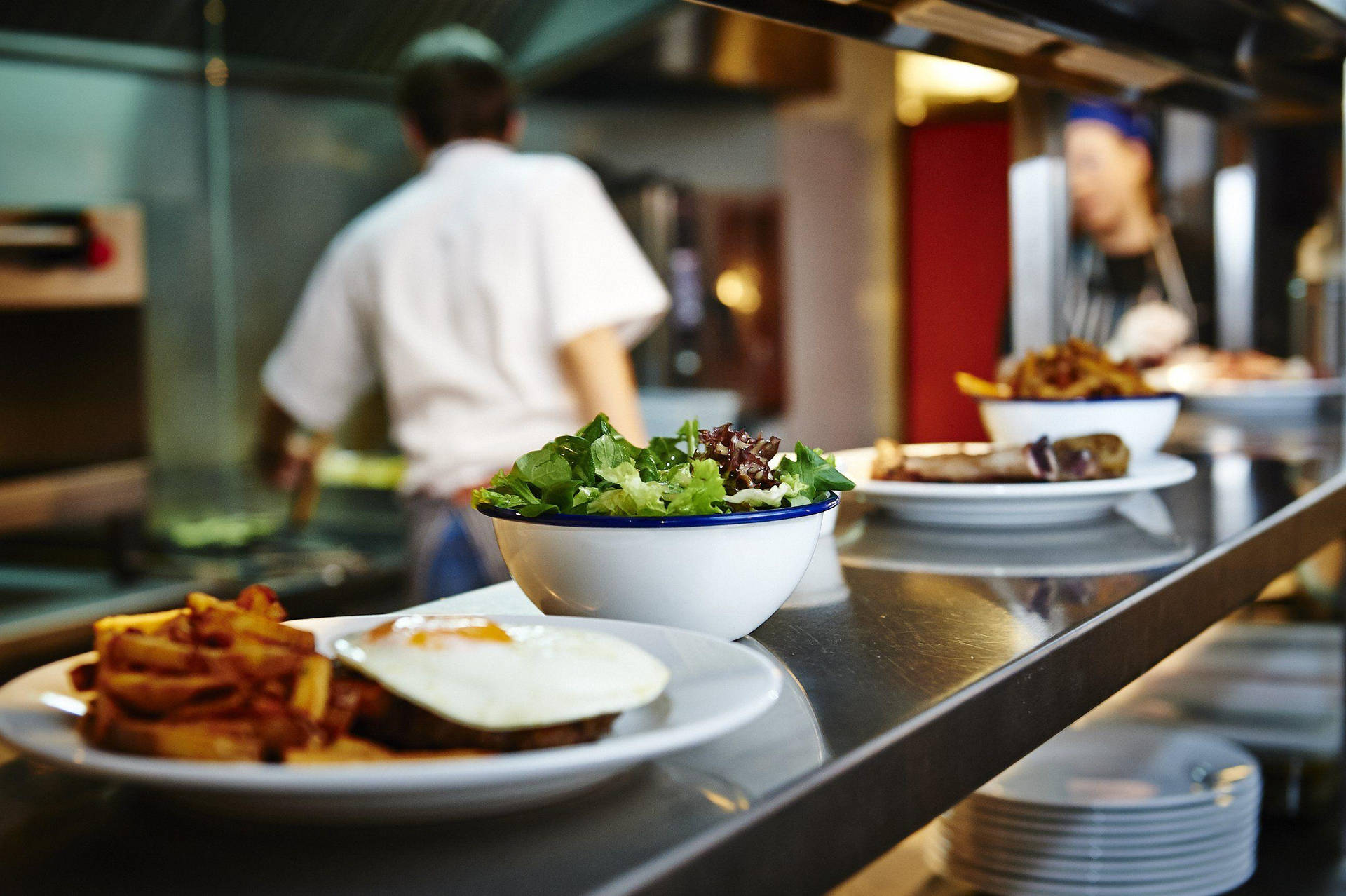 Ordered Food In Kitchen Restaurant Background