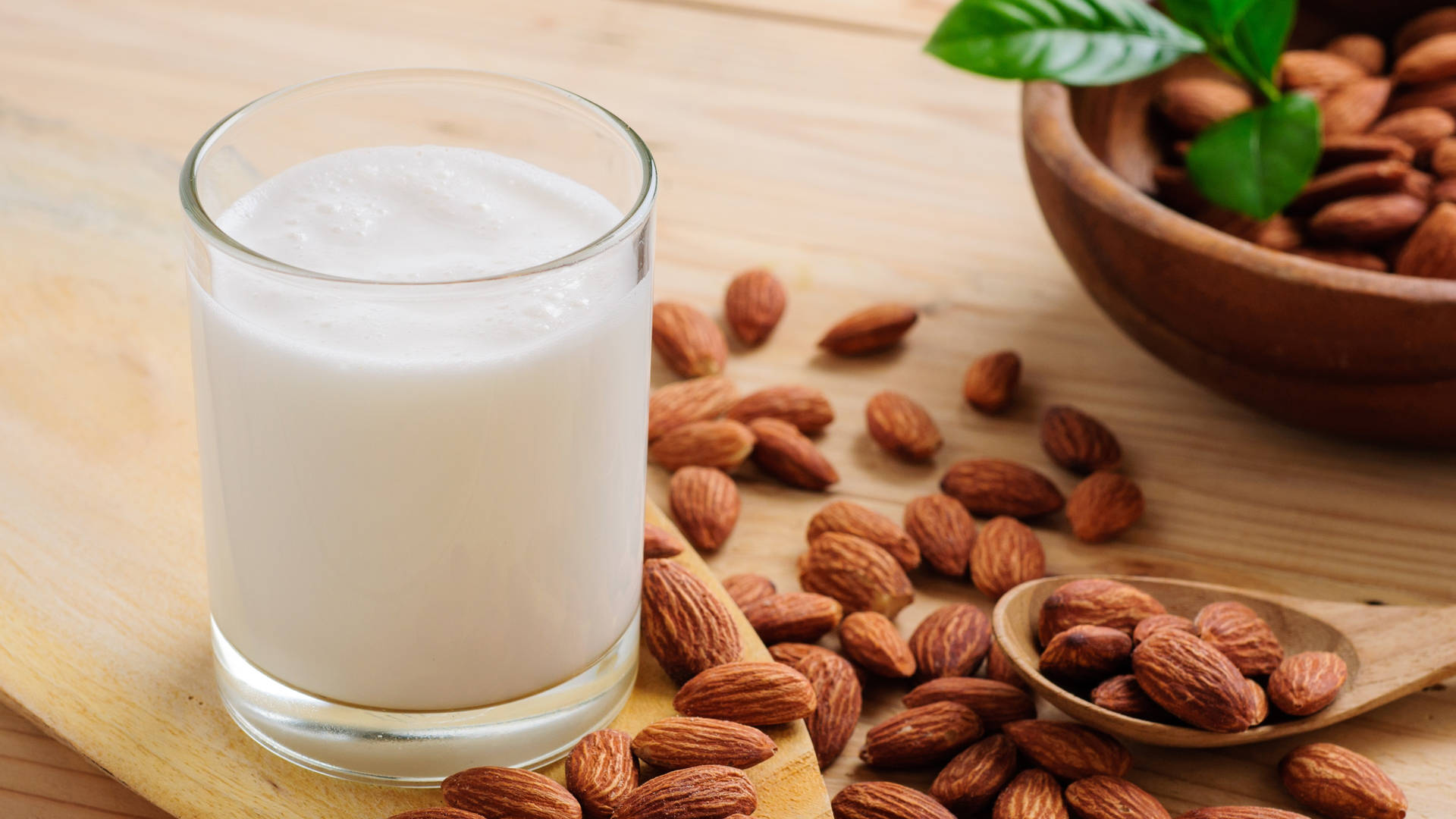 Organic Almond Milk In A Glass Background