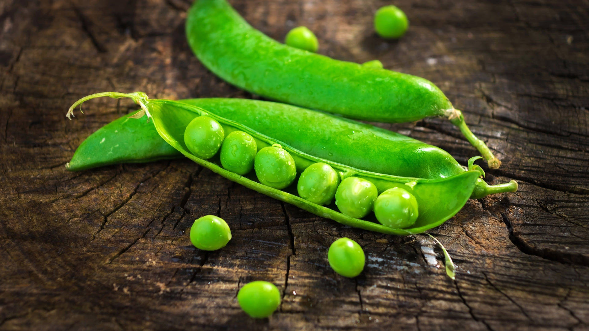 Organic Vegetable Green Peas Close And Opened Pod Background