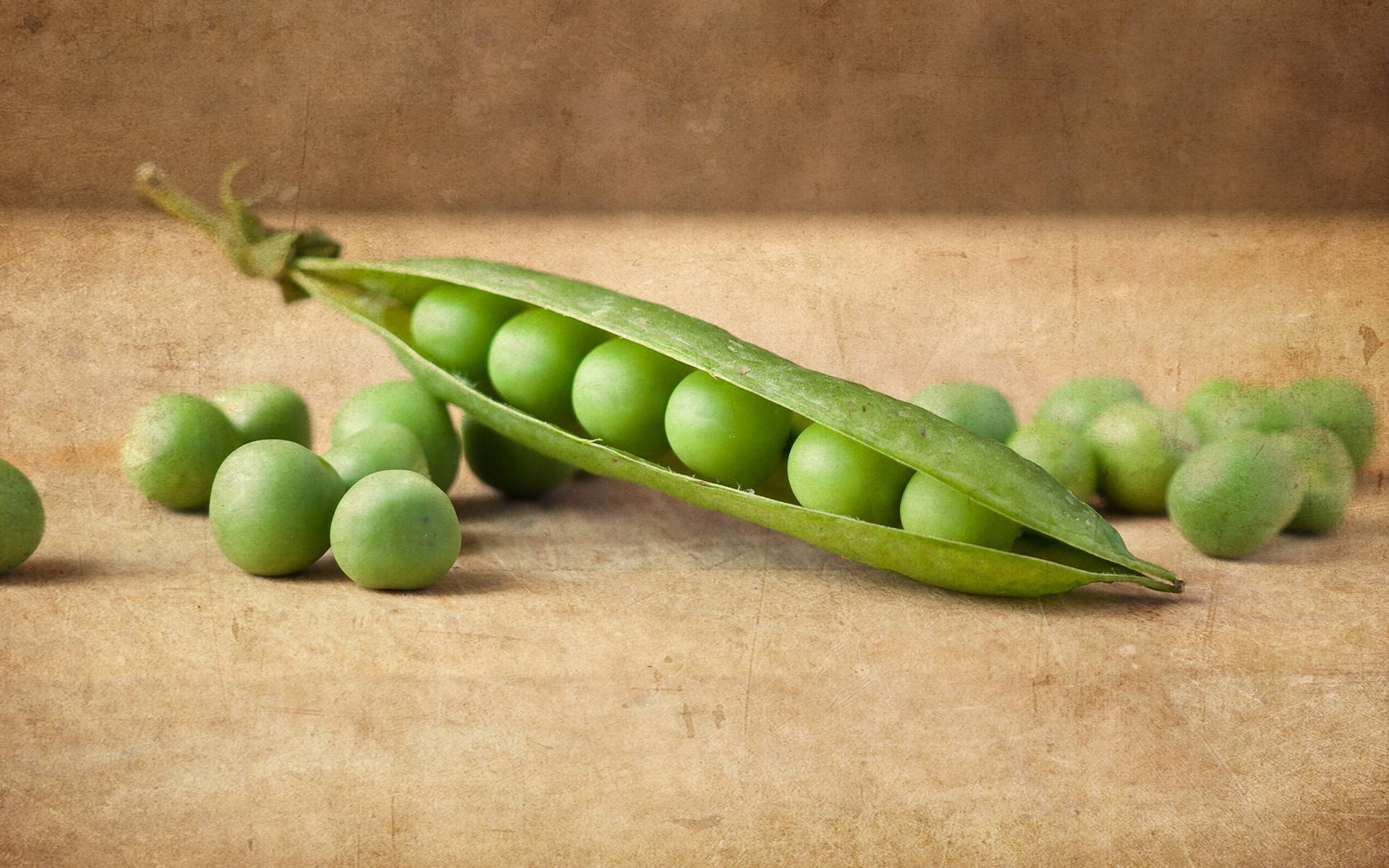 Organic Vegetable Green Peas With Half Opened Pod Background