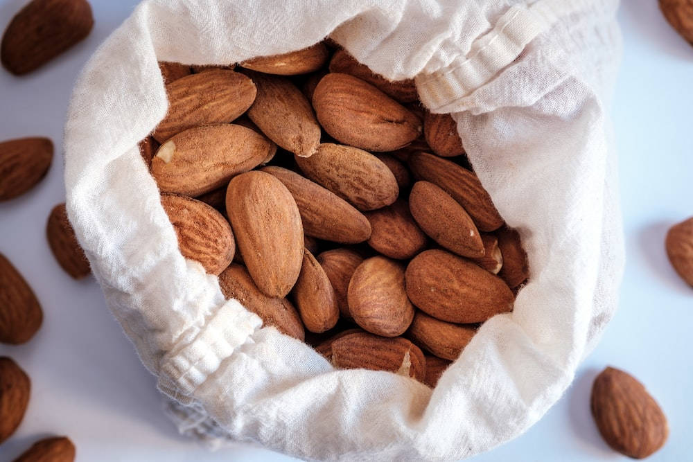 Organic Whole Almond Nuts Background