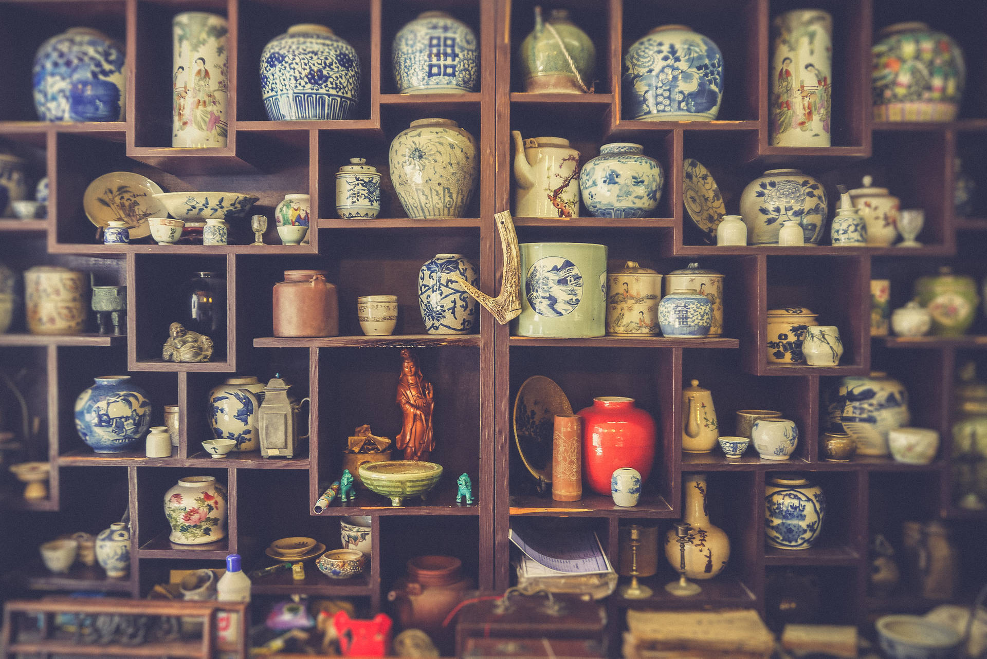 Oriental Ceramics On Shelves Background