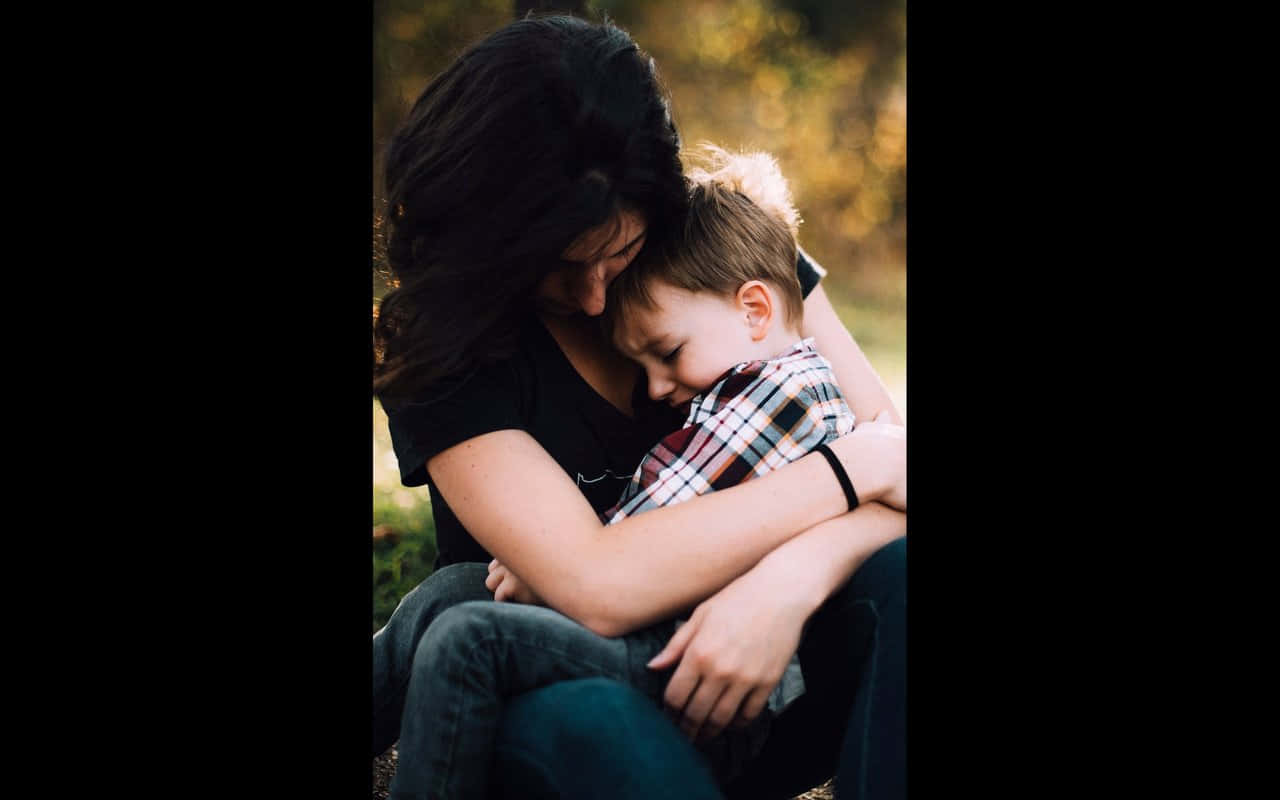 Ornery Kid With His Mother Background