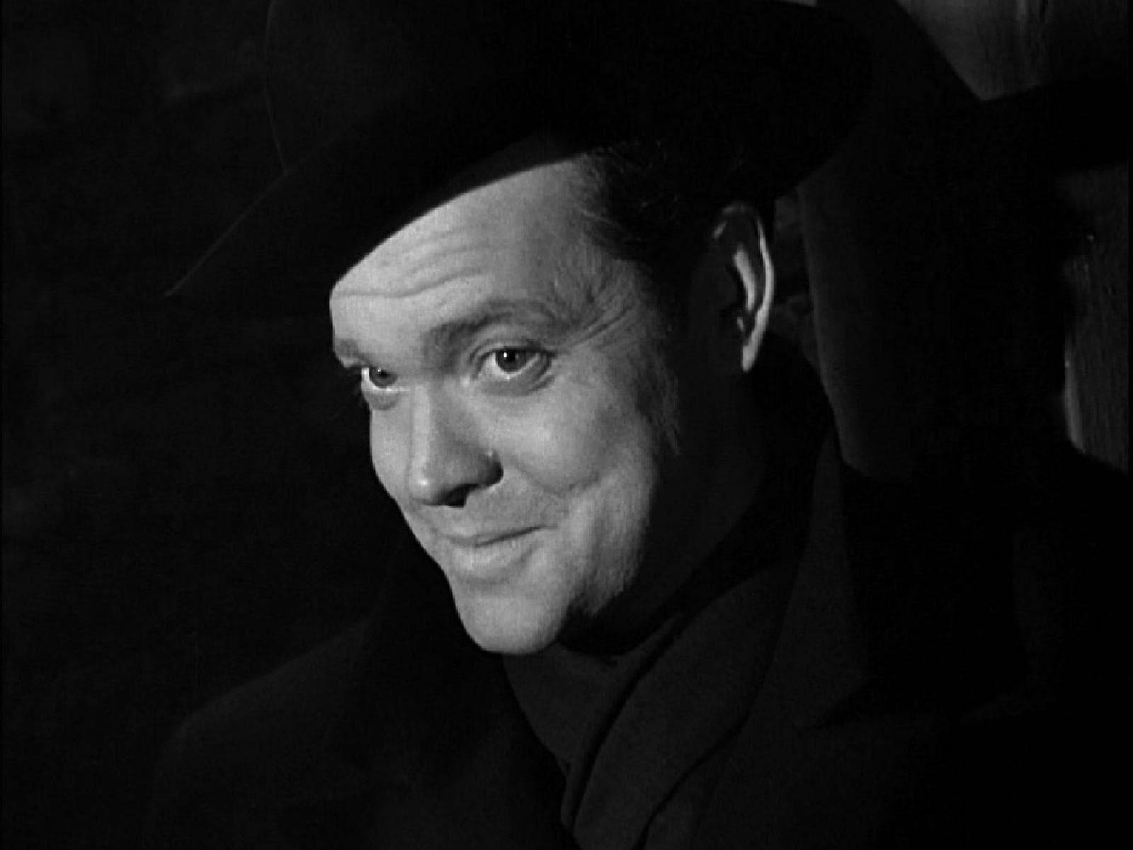 Orson Welles, A Figure Of Classic Cinema, Adorned In Black.