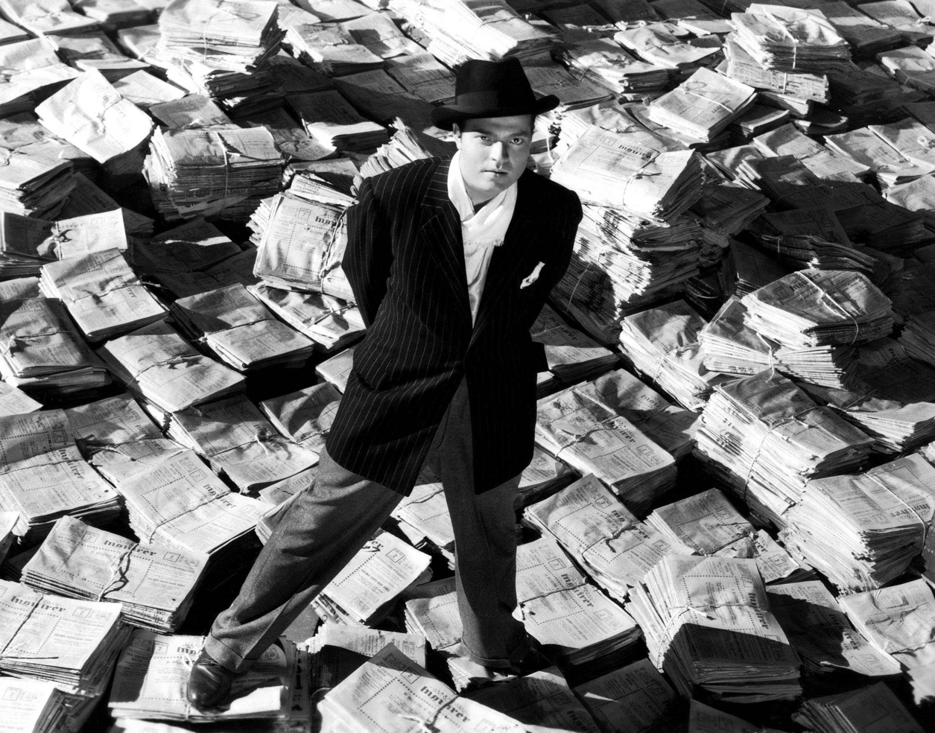 Orson Welles Pondering Scene In Citizen Kane Background