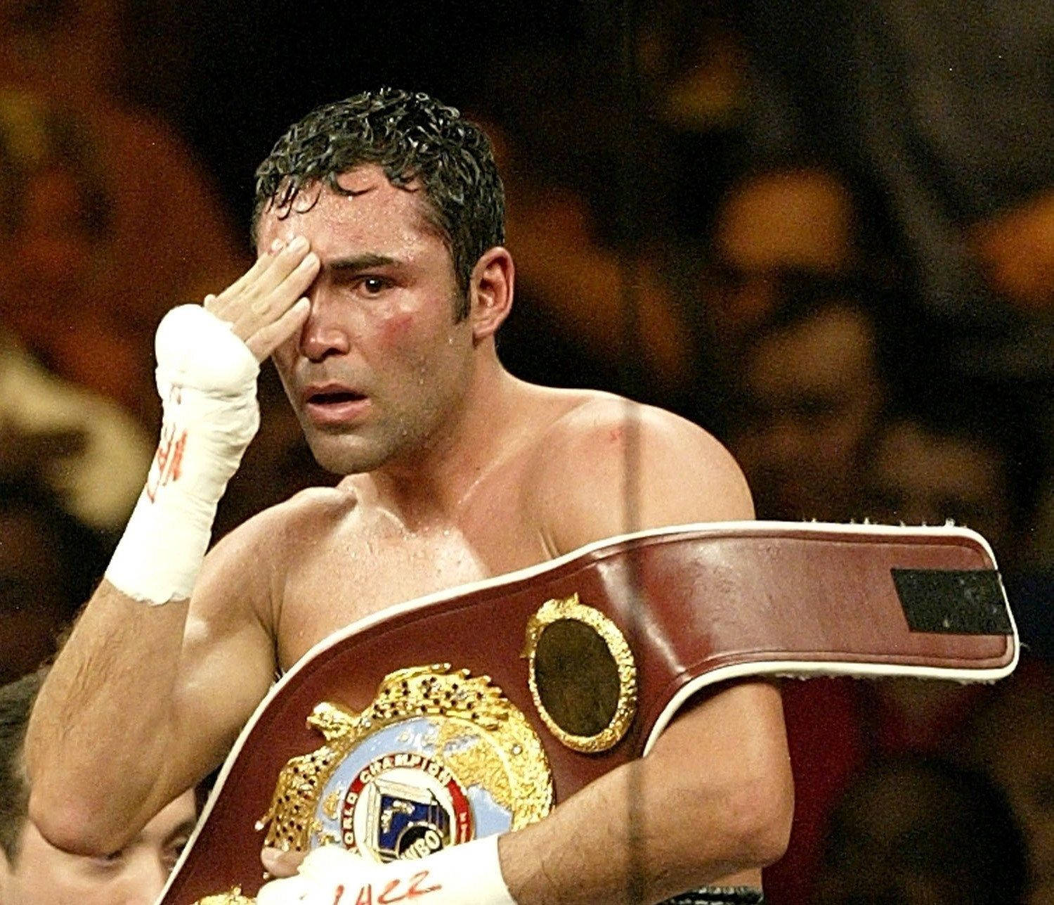 Oscar De La Hoya With Championship Belt Background