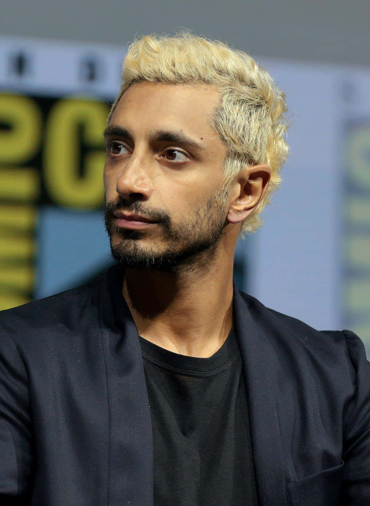 Oscar Nominee Riz Ahmed Captured In A Pensive Mood Background