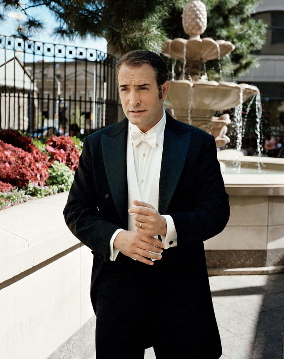 Oscar-winning Actor Jean Dujardin Poses For A Striking Portrait. Background