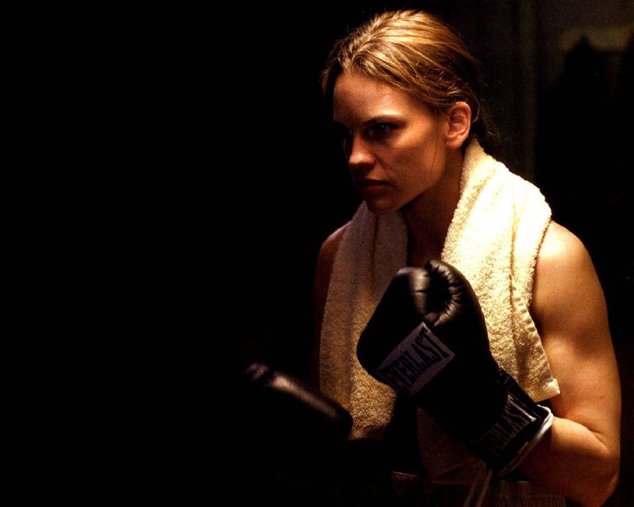 Oscar-winning Actress, Hilary Swank, In A Dramatic Scene From Million Dollar Baby. Background