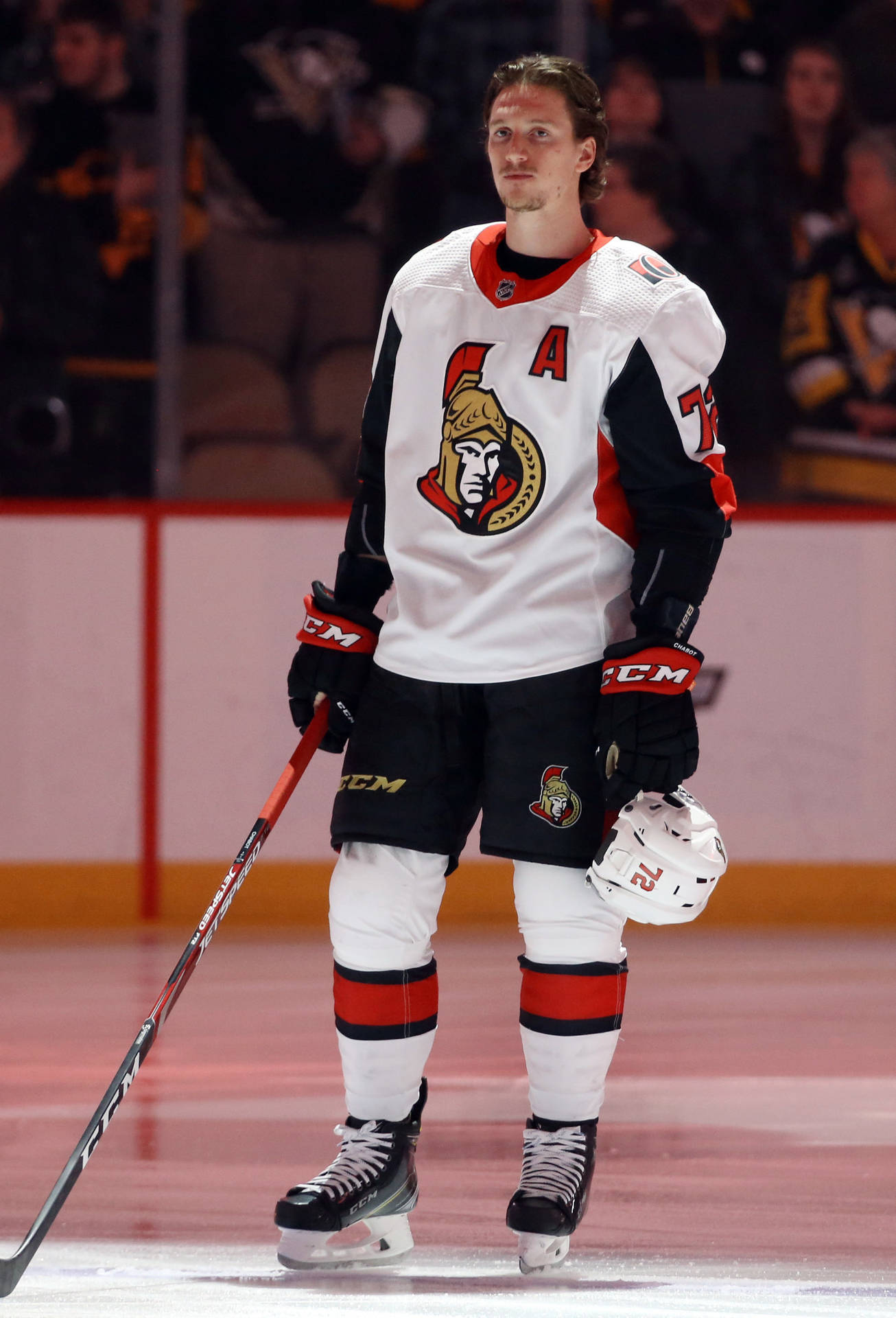 Ottawa Senators' Star Defenseman, Thomas Chabot, In Action. Background