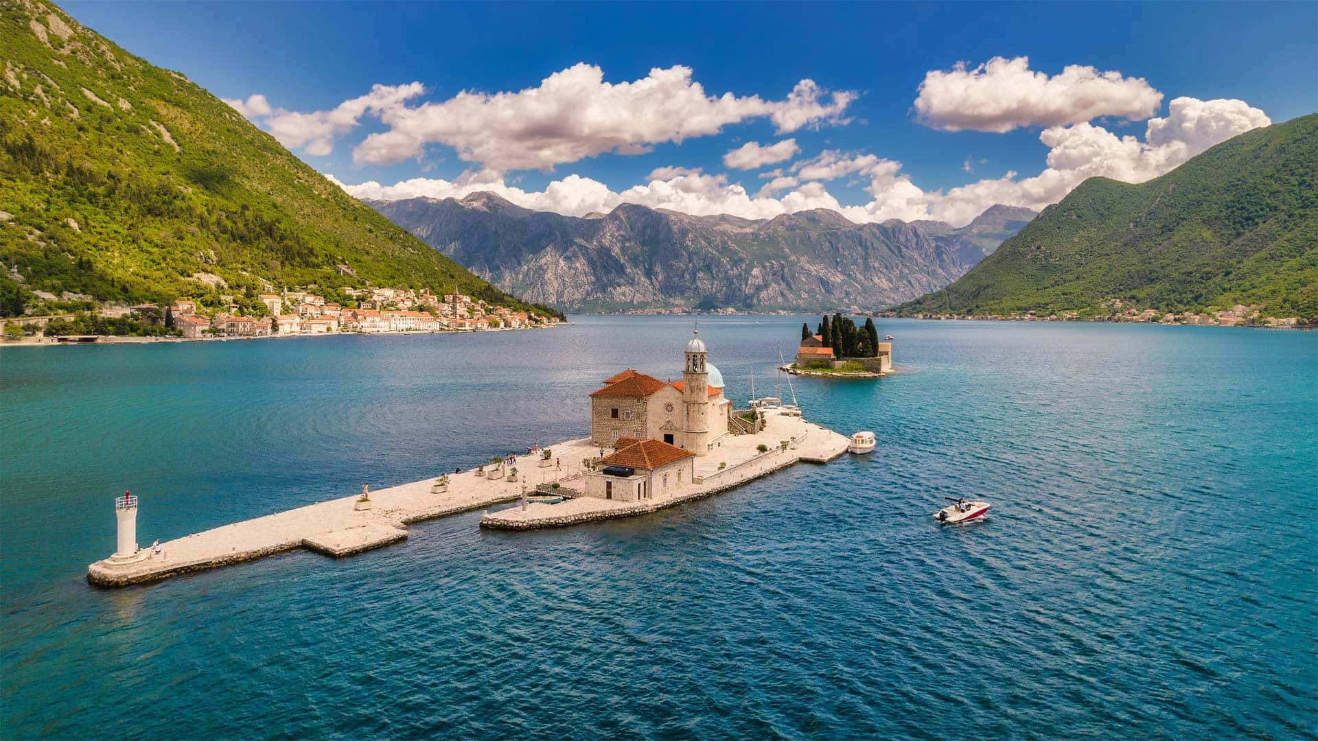 Our Lady Of The Rocks With Boat Background