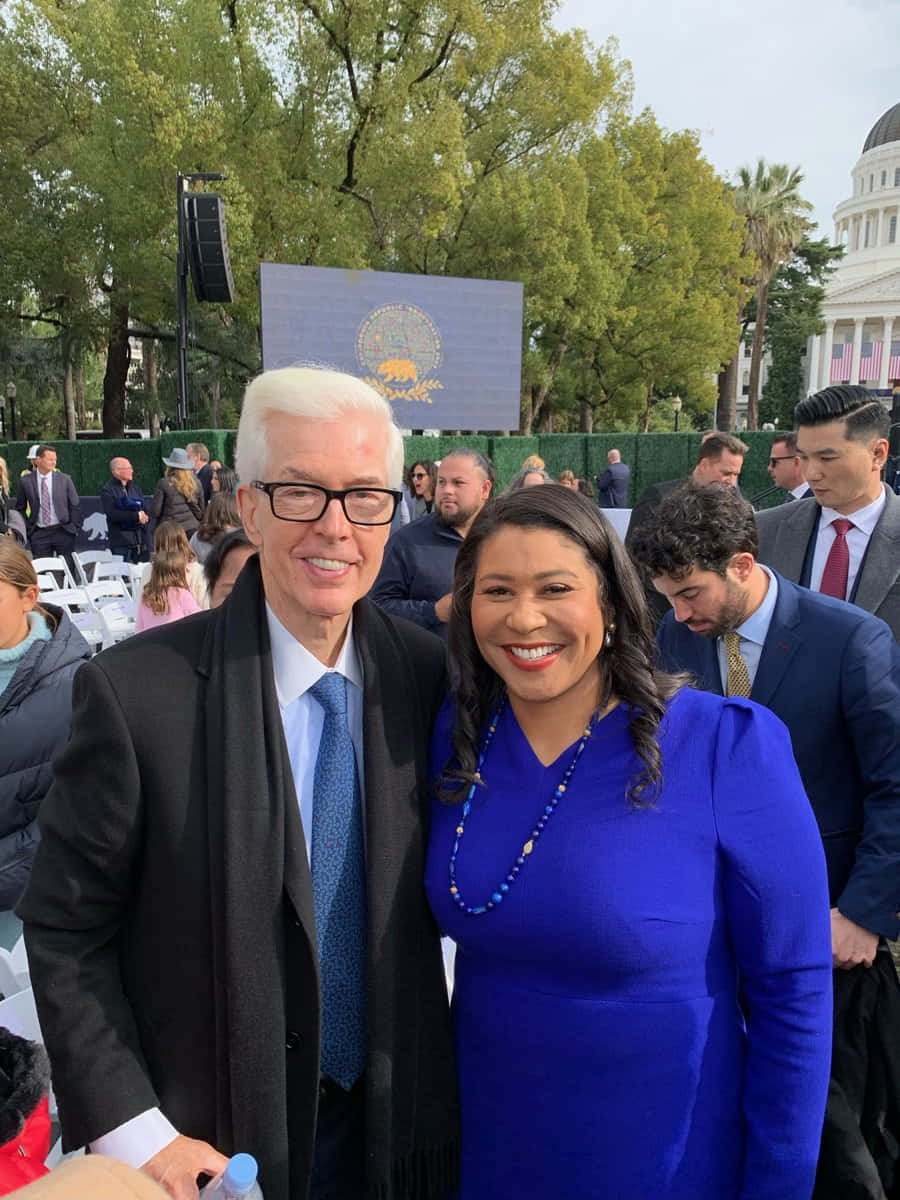 Outdoor Event With Two Smiling Individuals