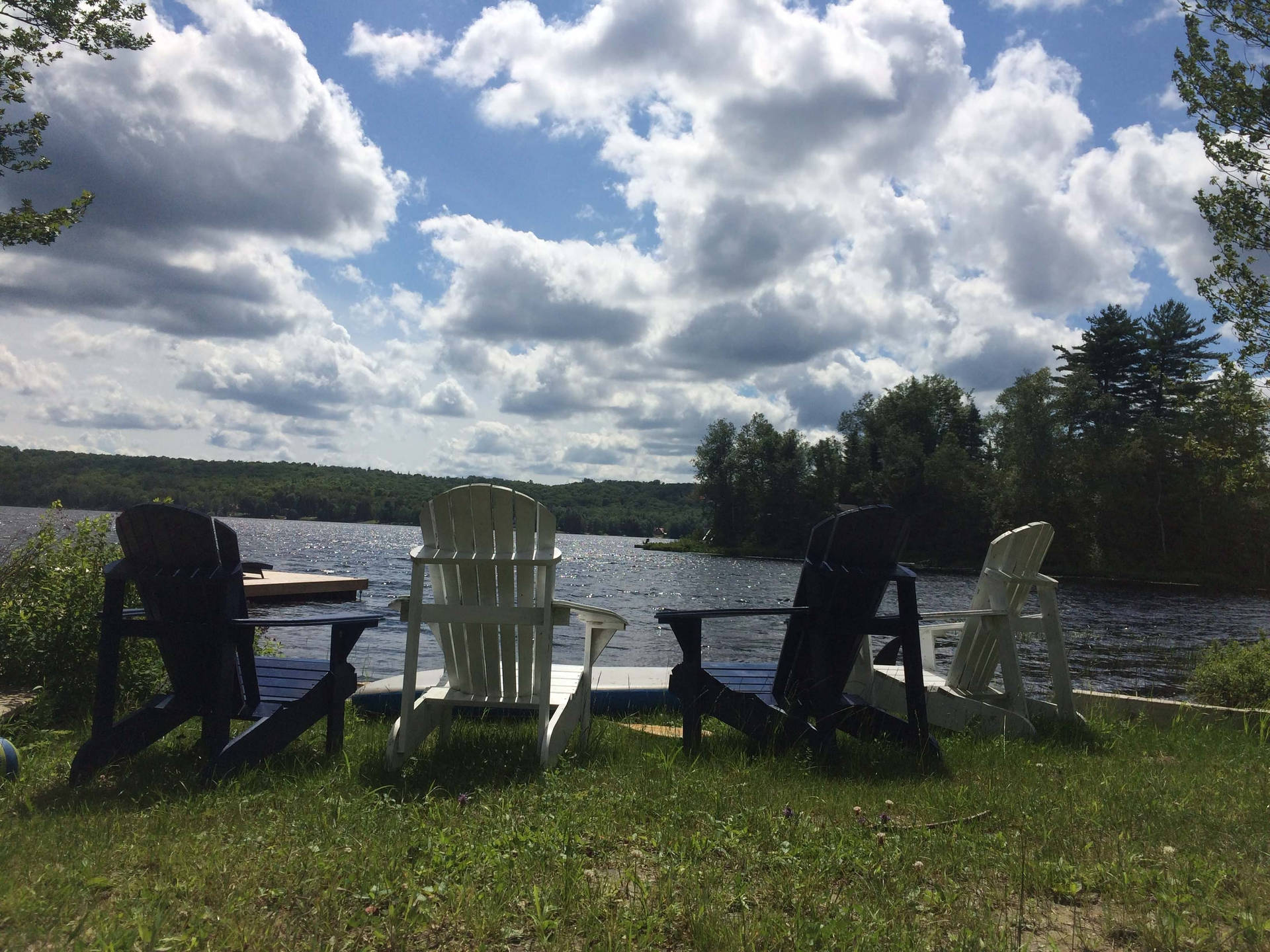 Outdoor Lawn Chairs At Lake Background