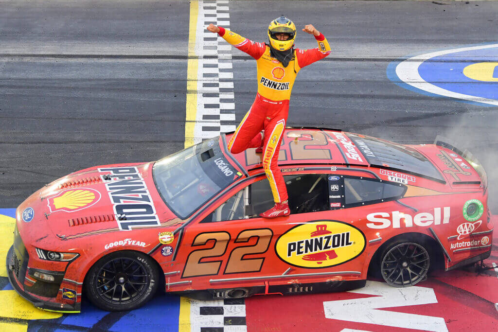 Outgoing Nascar Star - Joey Logano Leaning On His Race Car