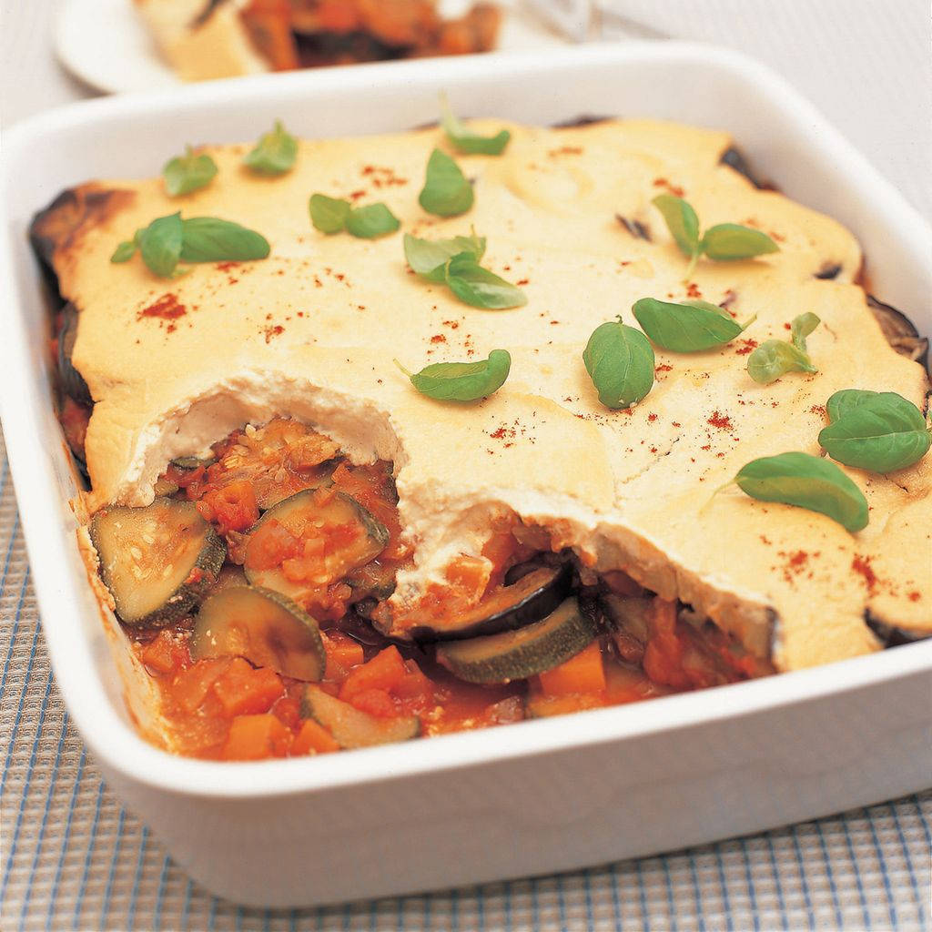 Oven-baked Moussaka Topped With Slices Of Eggplant Background