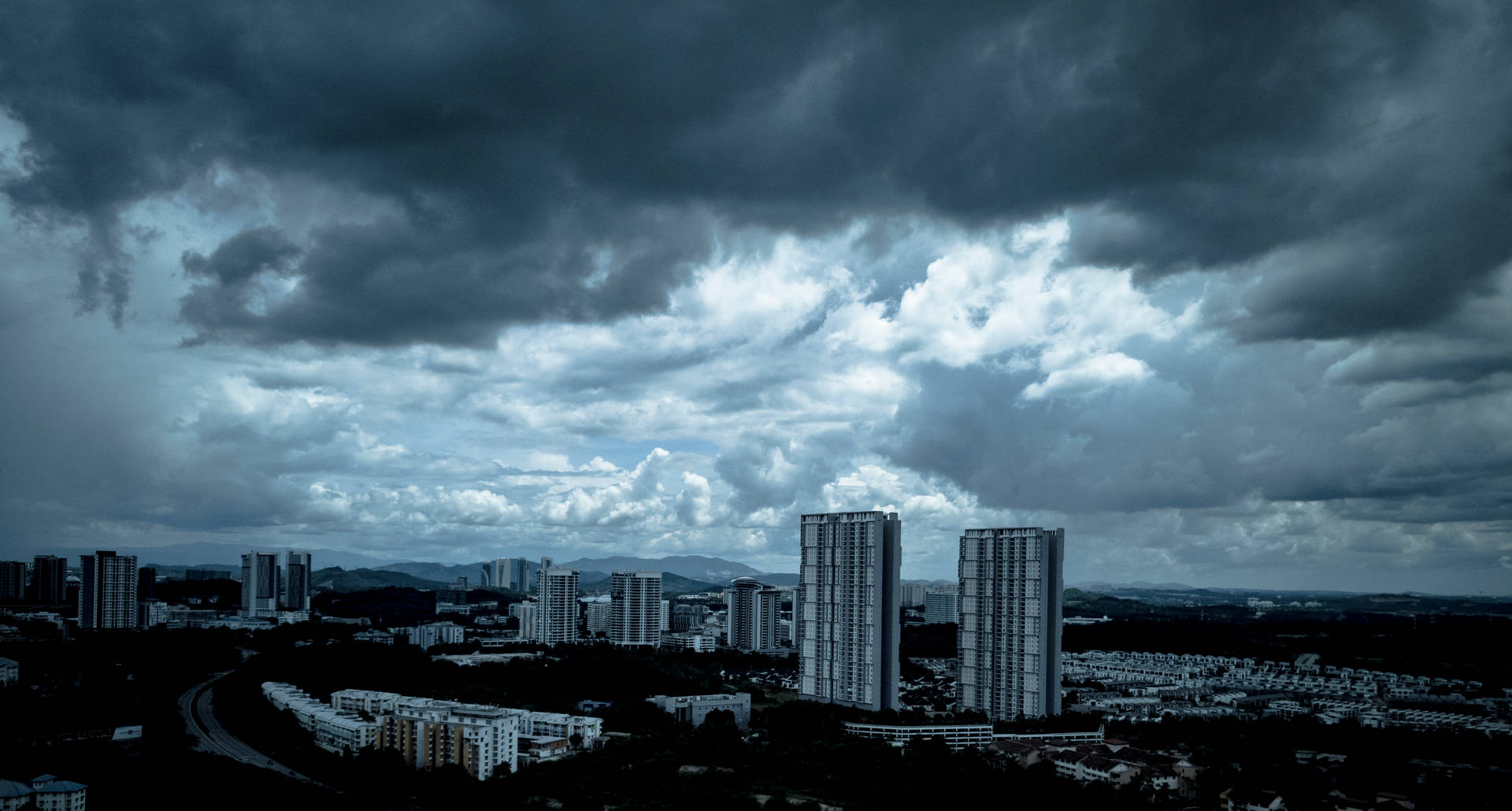 Overcast Dark Blue Clouds Over City Background
