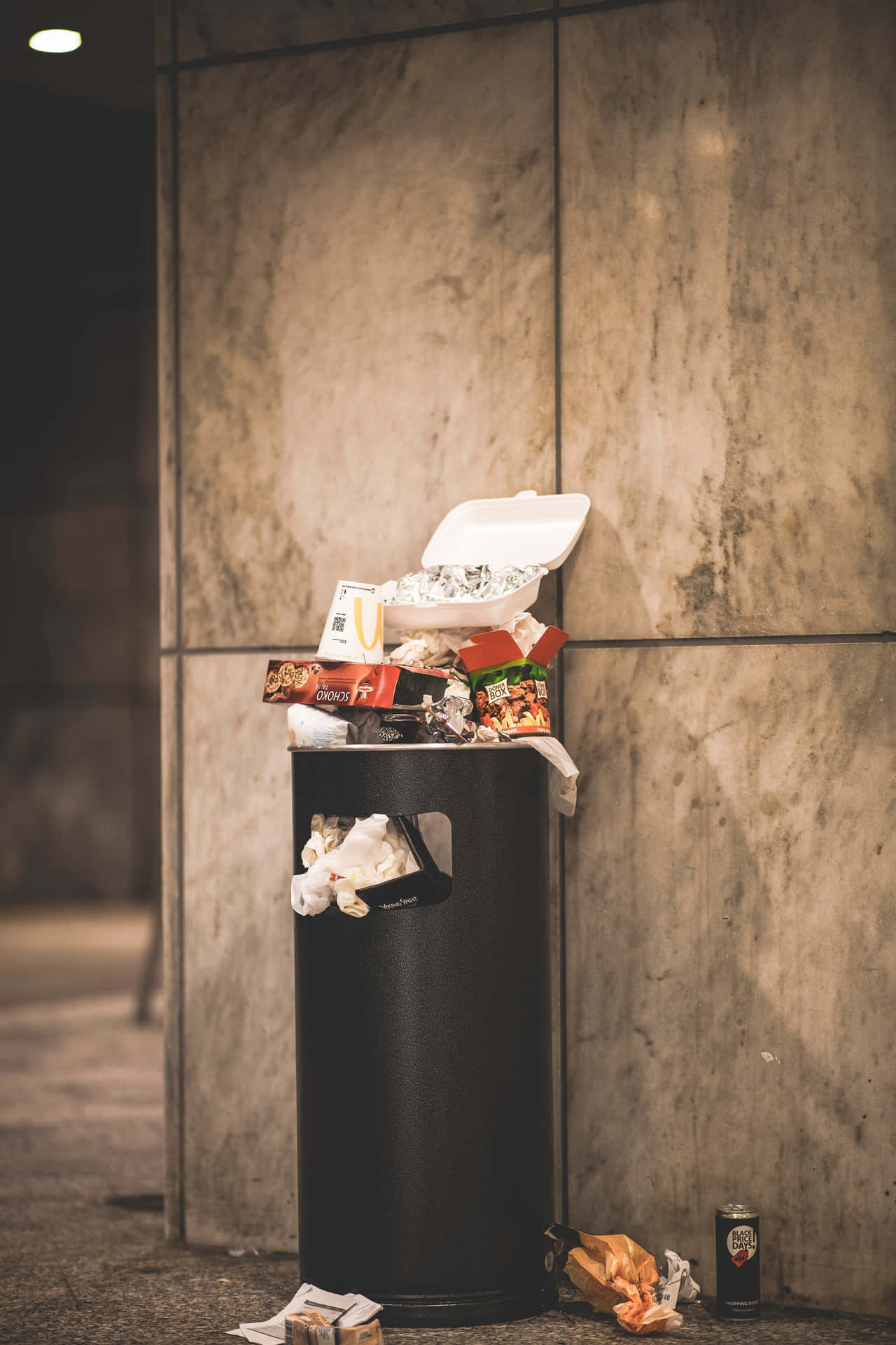 Overflowing Black Trash Can Background