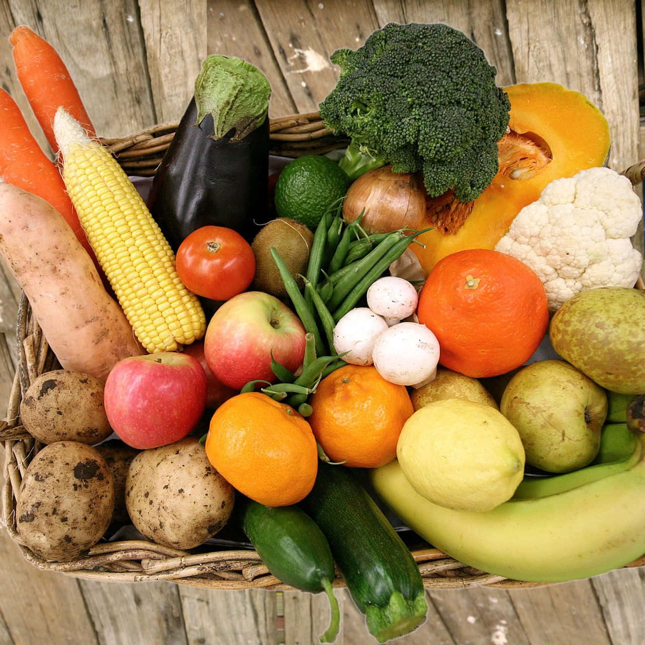 Overhead Shot Of Fruits And Vegetables On A Wicker Tray