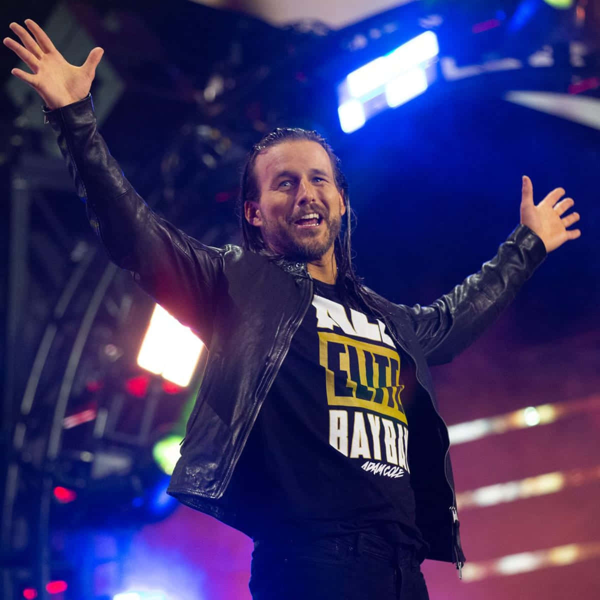 Overjoyed Adam Cole On Stage Background