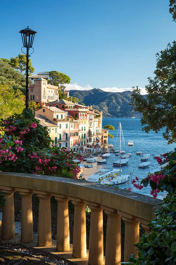 Overlooking Sea And Mountains In Portofino Italy Background