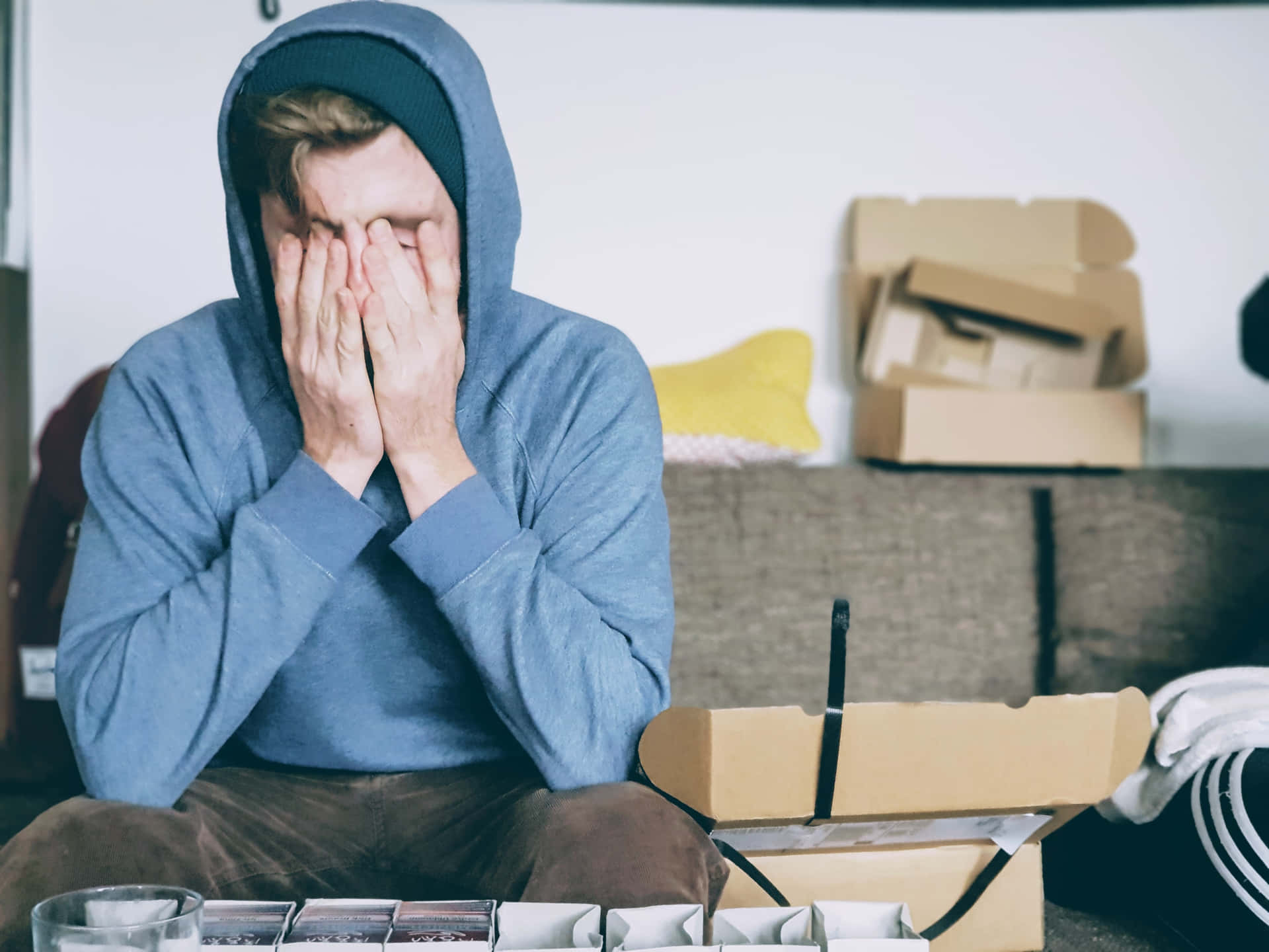 Overwhelmed Man In A Hoodie Background